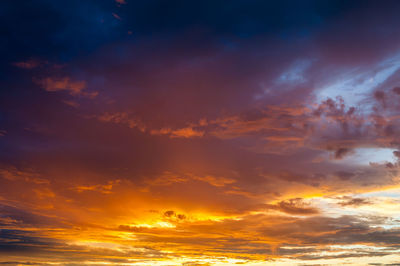Low angle view of dramatic sky during sunset