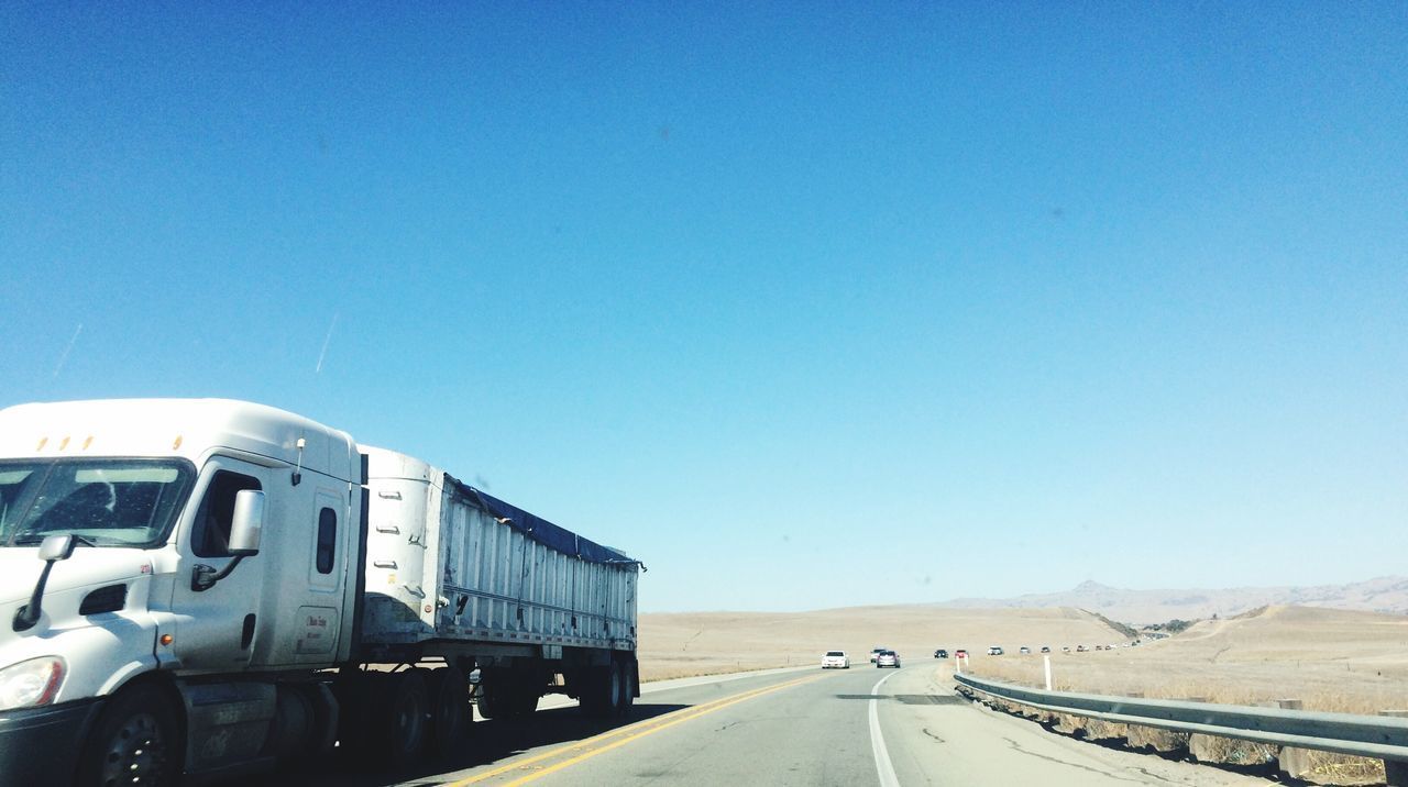 ROAD AGAINST BLUE SKY