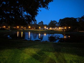 Scenic view of river against sky at night