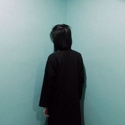 Close-up of woman standing in the dark