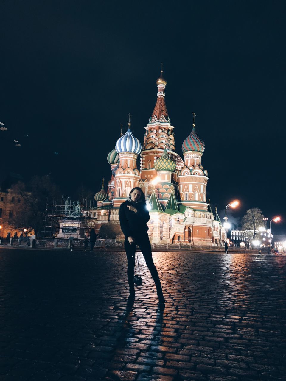 architecture, building exterior, built structure, night, illuminated, city, real people, full length, one person, religion, lifestyles, sky, travel destinations, place of worship, nature, belief, travel, building, street, outdoors