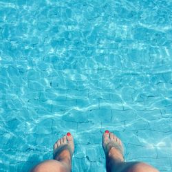 Low section of woman in swimming pool