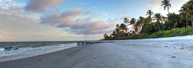 Scenic view of beach against sky during sunset