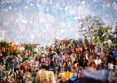 High angle view of people at park seen through glass window