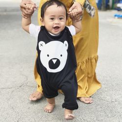 Full length portrait of cute girl smiling