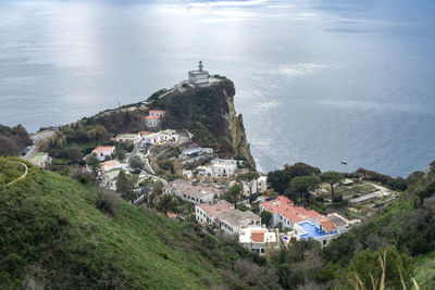 High angle view of townscape by sea