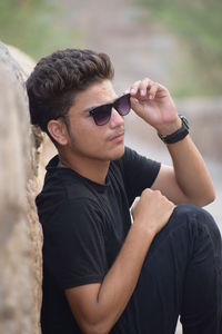 Portrait of young man wearing sunglasses