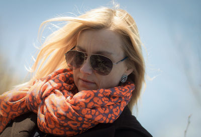 Low angle view of woman in sunglasses during sunny day