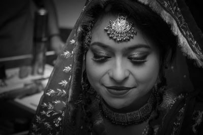 Close-up of smiling bride in wedding sari