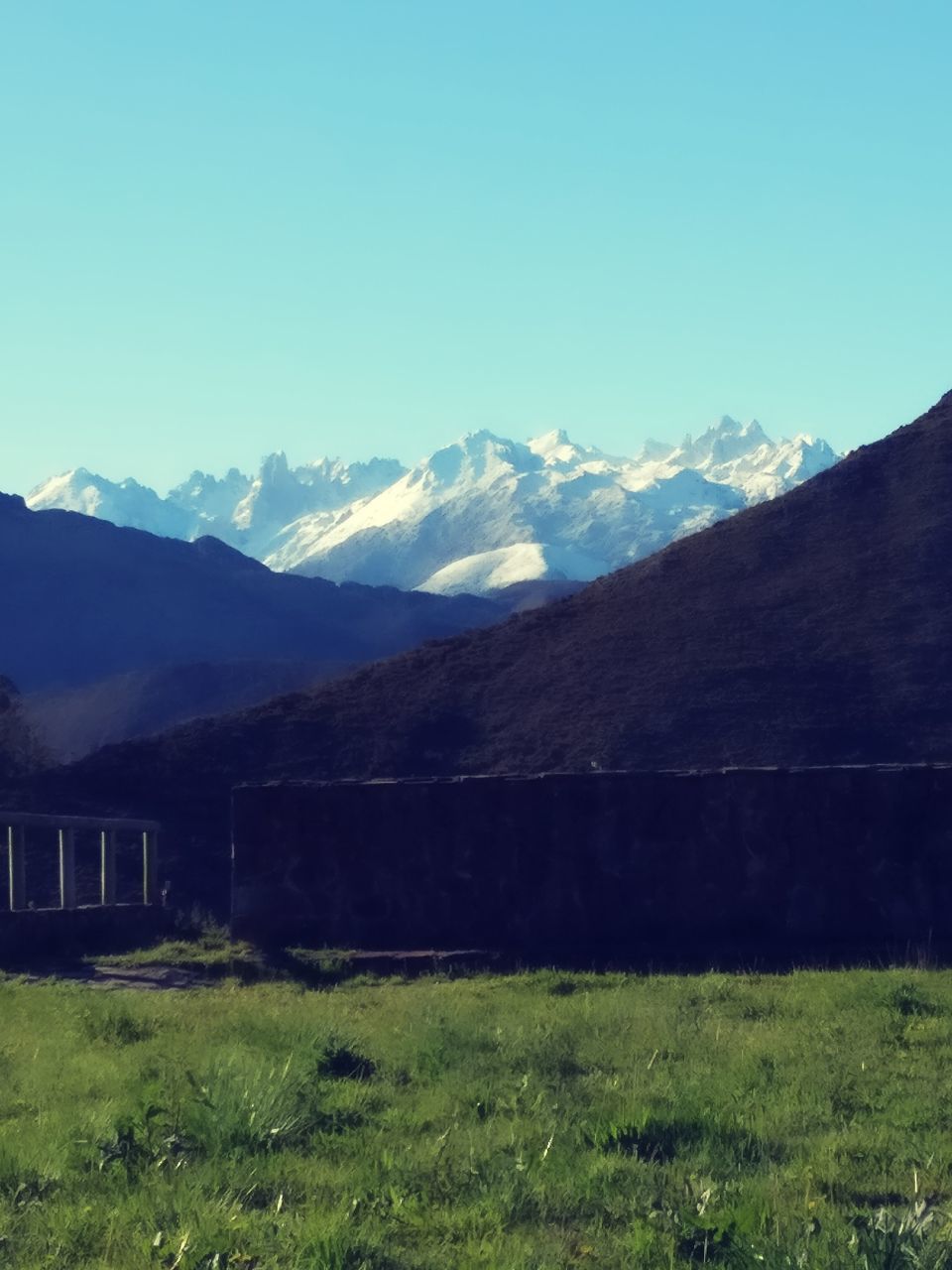 mountain, mountain range, tranquility, tranquil scene, beauty in nature, landscape, scenics, nature, clear sky, no people, outdoors, built structure, day, building exterior, architecture, sky