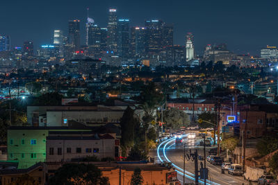 Illuminated buildings in city at night