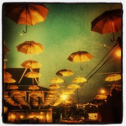 Illuminated lights against sky