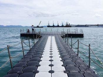 Pier over sea against sky