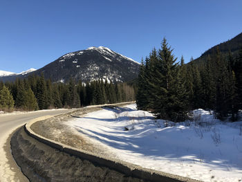 Scenic view of snowcapped mountains against clear sky