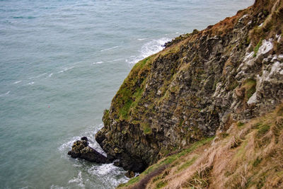 High angle view of rock formation by sea