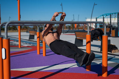 Muscular man exercising outdoors