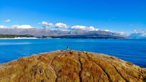 Scenic view of sea against blue sky