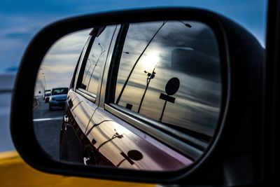 Reflection of sky on side-view mirror