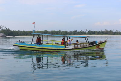 Boat sailing in river against sky