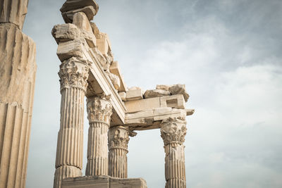 Low angle view of historical building against cloudy sky