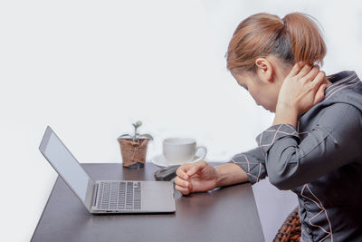 Man using laptop on table