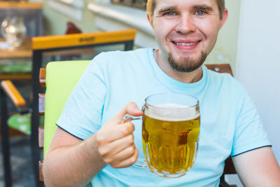 Portrait of a man drinking glasses