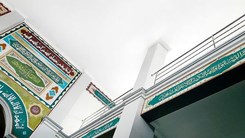 Low angle view of staircase by building against sky