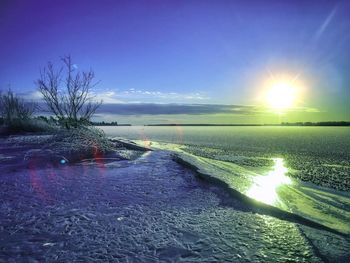 Scenic view of sea against clear sky during sunset