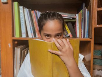 Portrait of girl in book