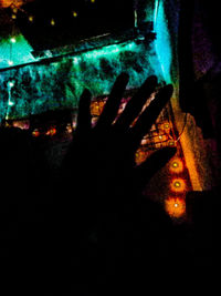 Close-up of hands at night