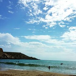 Scenic view of sea against cloudy sky