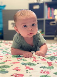 Close-up of cute baby boy at home