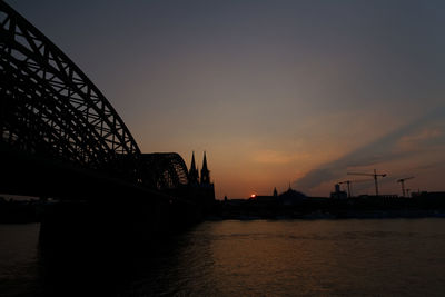 Built structure against sky at sunset