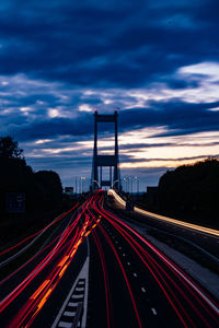 Light trails on highway at dusk