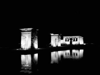 Reflection of building in water at night