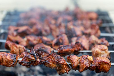 Close-up of meat on barbecue grill