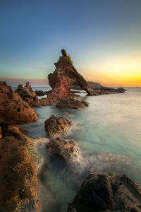 Scenic view of sea against sky during sunset