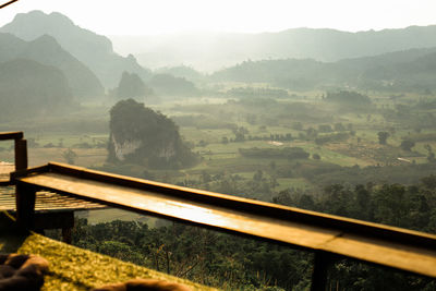 Scenic view of landscape and mountains against sky