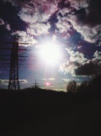 Low angle view of power lines against sky