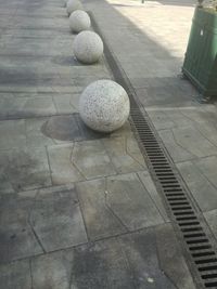 High angle view of stones on footpath