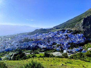 Scenic view of landscape against blue sky