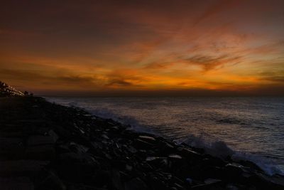 Scenic view of sea at sunset