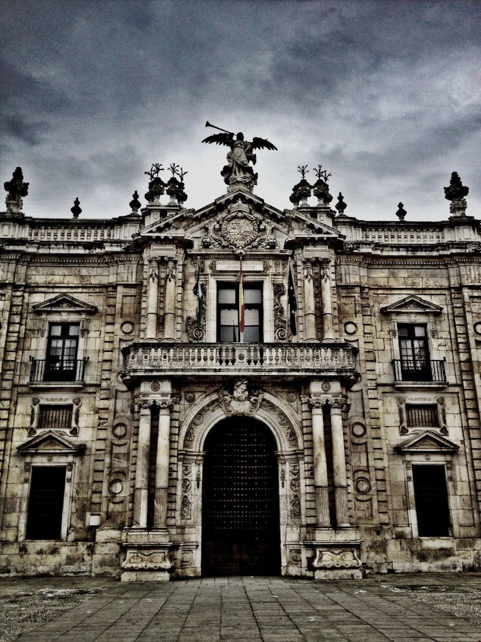 architecture, built structure, building exterior, sky, history, low angle view, cloud - sky, arch, facade, old, art and craft, window, building, art, historic, entrance, statue, day, outdoors, cloud