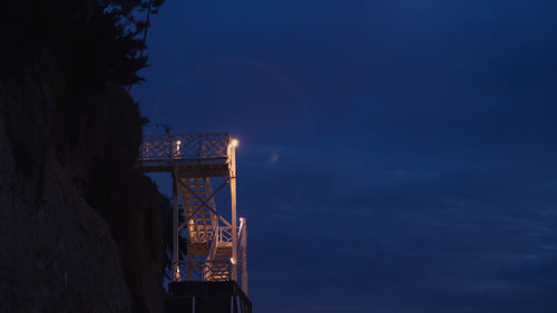 Low angle view of illuminated building against sky at night