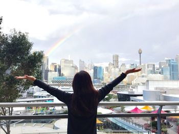 View of rainbow over cityscape