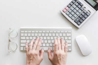 Directly above shot of person using laptop on table