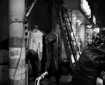 Man hanging in shopping mall