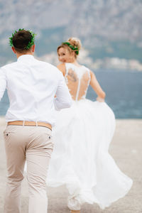 Young couple running outdoors