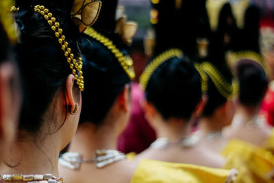 Rear view of women in traditional clothes during event