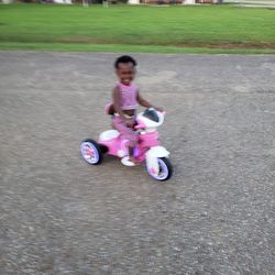 Full length of woman riding motorcycle